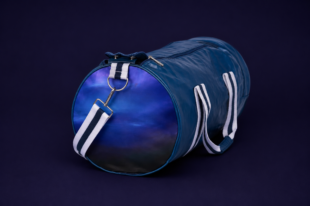 Neptune blue duffle bag side view with Neptune design and shoulder strap