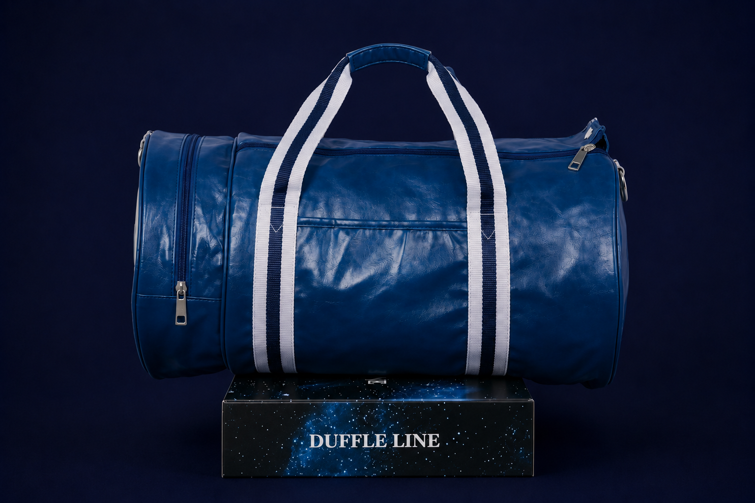 Neptune blue duffle bag side view with white and navy handles on Duffle Line packaging