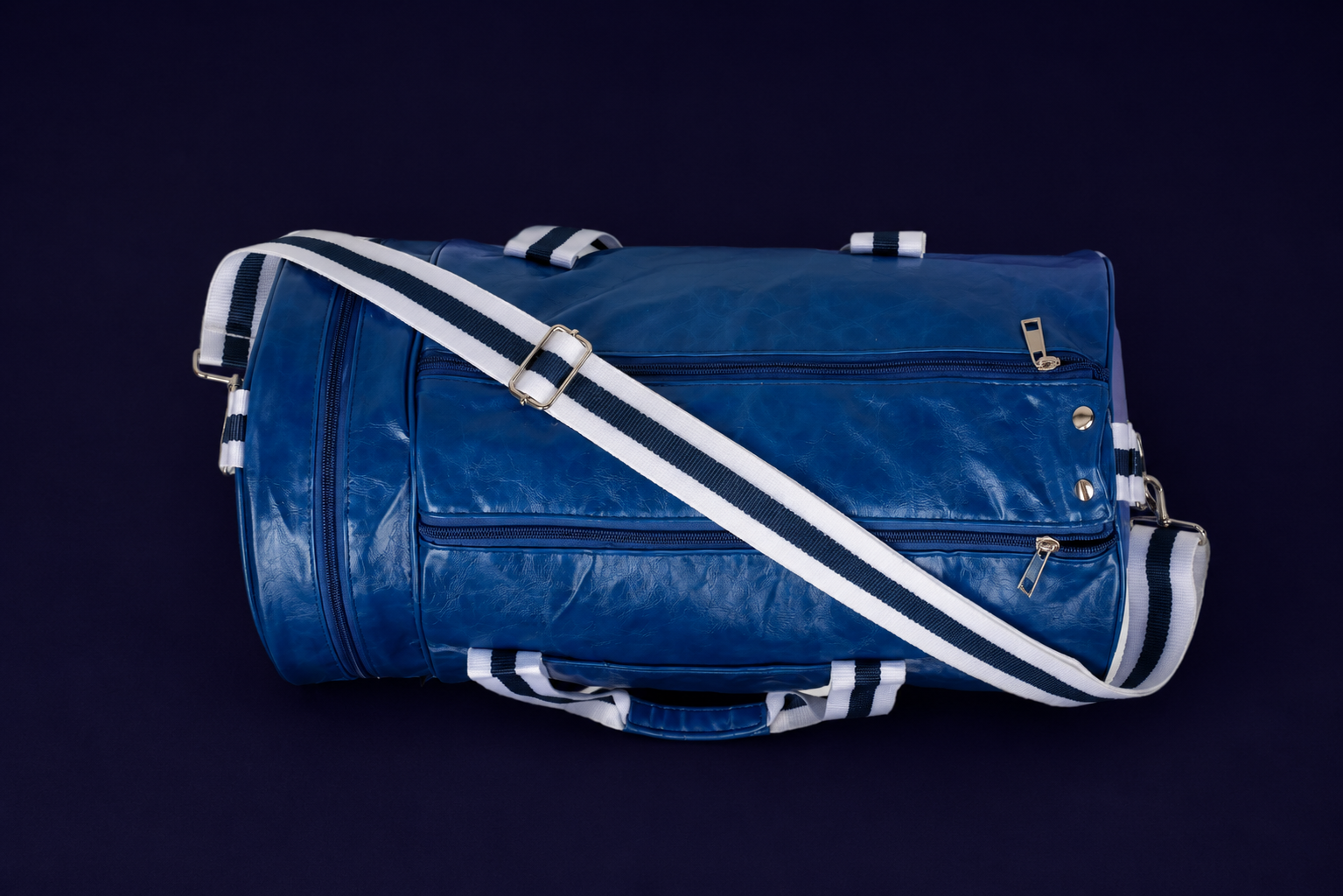 Neptune blue duffle bag top view with white and navy straps